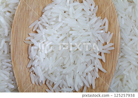 Food ingredient. White organic rice grain background Food ingredient. White organic rice grain background 125257938