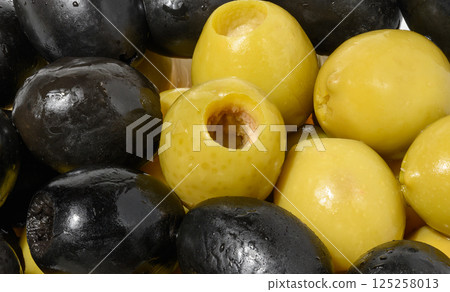Detailed close up mix of smooth, pitted green and black olives, filling the frame Detailed close up mix of smooth, pitted green and black olives, filling the frame 125258013