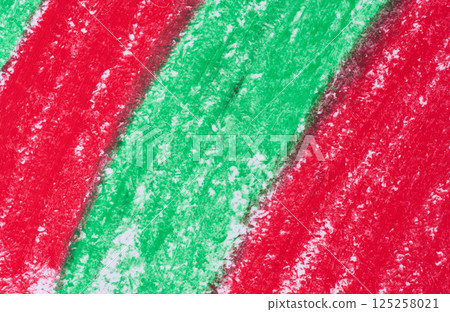 Diagonal strokes made with red and green crayons on a white surface, showing the waxy and slightly grainy texture Diagonal strokes made with red and green crayons on a white surface, showing the waxy and slightly grainy texture 125258021