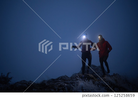 Night Trail Running in the Mountains 125258659