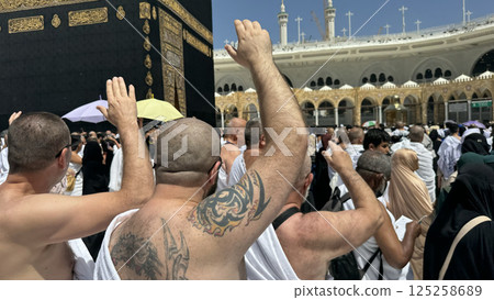 Muslim pilgrims perform Tawaf around the Kaaba after dawn prayer at Masjid al-Haram in Makkah, Saudi Arabia. Muslims worldwide face the Kaaba in prayer, symbolizing unity and devotion in Islam 125258689