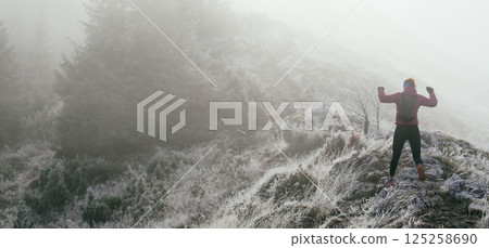 Trail Runner in Misty Mountain Landscape 125258690