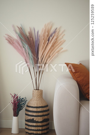 Elegant dried floral arrangements in a cozy living room setup Elegant dried floral arrangements in a cozy living room setup 125259589