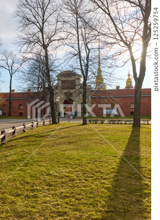 the Peter and Paul Fortress spire at sunset 125259754