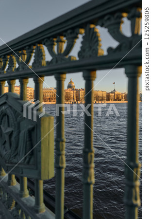 Admiralty embankment with lion monuments from the Palace Bridge at sunset 125259806