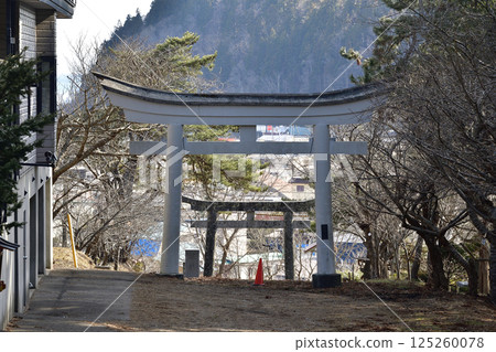 Photographing the grounds of Yakushi Tenmangu Shrine in spring in Hokuto, Hokkaido 125260078