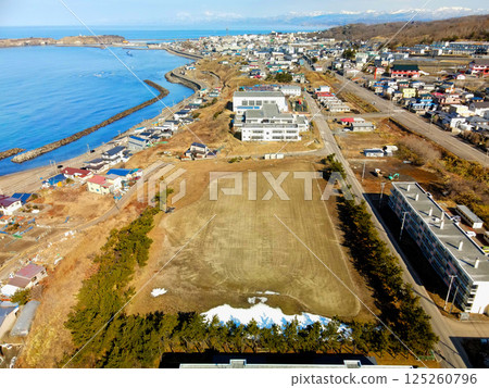 Aerial view of Minamigaoka Elementary School in Esashi, Hokkaido in early spring Aerial view of Minamigaoka Elementary School in Esashi, Hokkaido in early spring 125260796