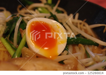 Soft-boiled egg with a runny yolk 125260814