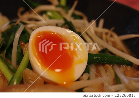 Soft-boiled egg with a runny yolk 125260815