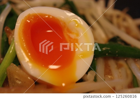 Soft-boiled egg with a runny yolk 125260816