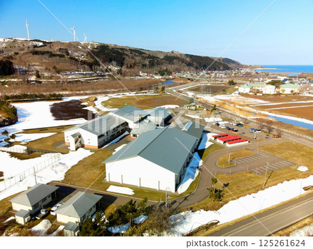 Aerial view of Kaminokuni Junior High School in early spring in Kaminokuni, Hokkaido 125261624