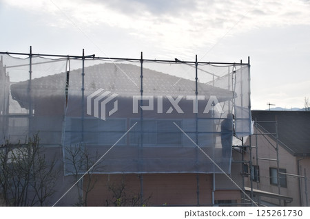 Paint application, installation of anti-scattering net, material, background Paint application, installation of anti-scattering net, material, background 125261730