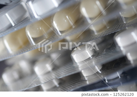 Close-up view of various medicine blister packs stacked together Close-up view of various medicine blister packs stacked together 125262120