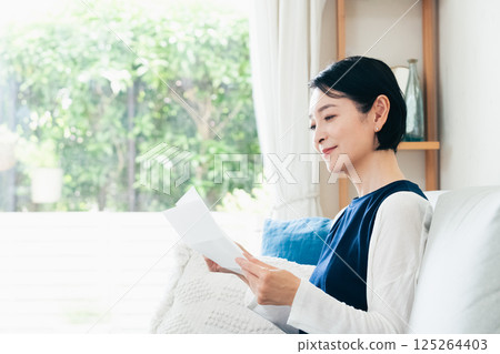A woman reading a letter A woman reading a letter 125264403