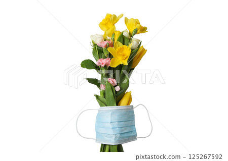 Bright flowers arranged with a mask symbolize appreciation for nurses, isolated on white 125267592