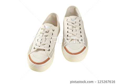 Summer shoes, Stylish white sneakers designed for everyday wear with a comfortable fit and versatile look, isolated on white, PNG 125267616