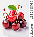 Red cherry berries on a white background lie in a pile 125268569