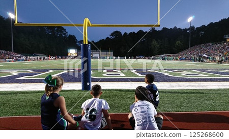 Children watching American football 125268600