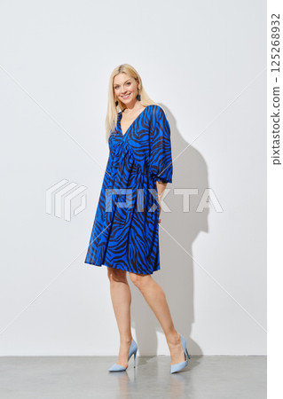 woman in patterned dress woman in patterned dress 125268932