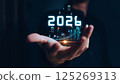 Businessman analyzing 2025 profit growth performance for the 2025-2026 financial plan. Image depicts market concepts, finance trends, revenue graphs, money, and profitability analysis for future 125269313