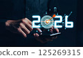 Businessman analyzing 2025 profit growth performance for the 2025-2026 financial plan. Image depicts market concepts, finance trends, revenue graphs, money, and profitability analysis for future 125269315
