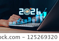 Businessman analyzing 2025 profit growth performance for the 2025-2026 financial plan. Image depicts market concepts, finance trends, revenue graphs, money, and profitability analysis for future 125269320