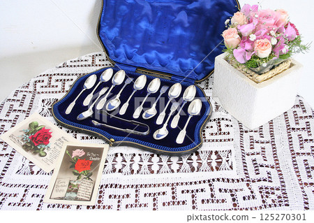 Antique British silver spoon and flowers Antique British silver spoon and flowers 125270301