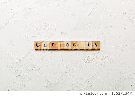 curiosity word written on wood block. curiosity text on table, concept 125271347