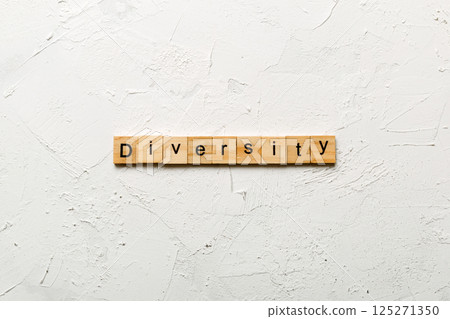 Diversity word written on wood block. Diversity text on cement table for your desing, concept Diversity word written on wood block. Diversity text on cement table for your desing, concept 125271350