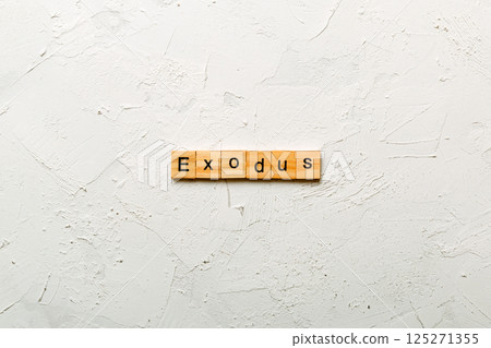 exodus word written on wood block. exodus text on table, concept exodus word written on wood block. exodus text on table, concept 125271355