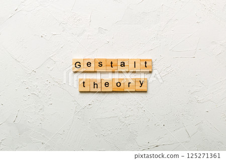 gestalt theory word written on wood block. gestalt theory text on cement table for your desing, concept 125271361