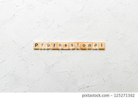 Professional word written on wood block. Professional text on cement table for your desing, concept 125271382