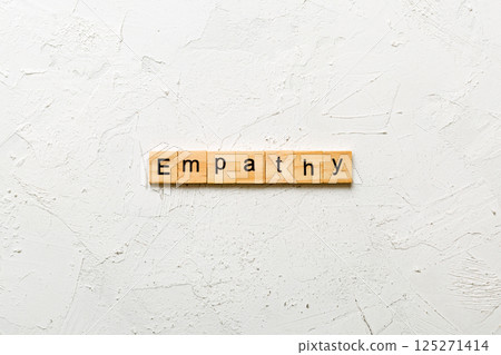 empathy word written on wood block. empathy text on table, concept 125271414