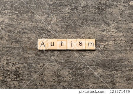 autism word written on wood block. autism text on table, concept autism word written on wood block. autism text on table, concept 125271479