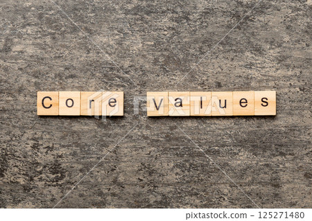 CORE VALUES word written on wood block. CORE VALUES text on cement table for your desing, concept CORE VALUES word written on wood block. CORE VALUES text on cement table for your desing, concept 125271480
