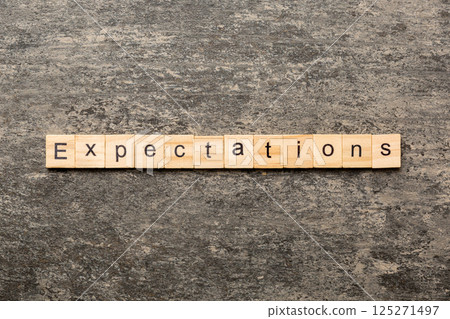 expectation word written on wood block. expectation text on table, concept 125271497