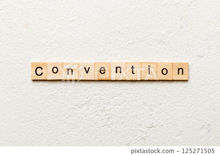 convention word written on wood block. convention text on cement table for your desing, concept convention word written on wood block. convention text on cement table for your desing, concept 125271505