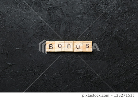 bonus word written on wood block. bonus text on table, concept bonus word written on wood block. bonus text on table, concept 125271535