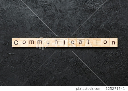 COMMUNICATION word written on wood block. COMMUNICATION text on cement table for your desing, concept 125271541