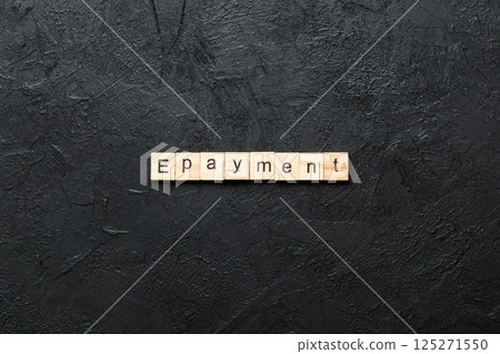 E-payment word written on wood block. E-payment text on cement table for your desing, concept E-payment word written on wood block. E-payment text on cement table for your desing, concept 125271550