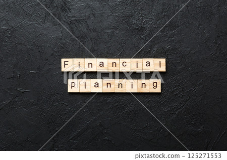 financial planning word written on wood block. financial planning text on cement table for your desing, concept 125271553