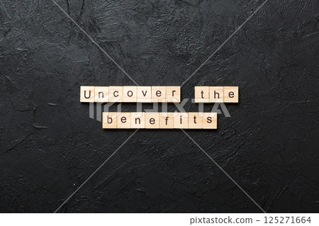 uncover the benefits word written on wood block. uncover the benefits text on table, concept uncover the benefits word written on wood block. uncover the benefits text on table, concept 125271664