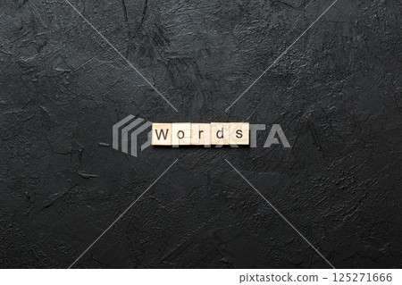 word written on wood block. WORD text on cement table for your desing, concept 125271666