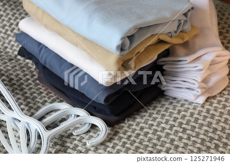 folded casual clothes, socks, tshirts folded casual clothes, socks, tshirts 125271946