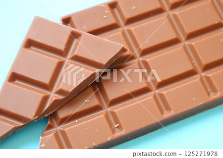 milk chocolate bar on blue background 125271978