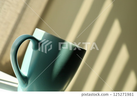 blue mug with spoon, close up blue mug with spoon, close up 125271981