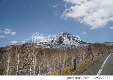 The snow-covered Shiretoko mountain range seen from the road to Shiretoko Pass The snow-covered Shiretoko mountain range seen from the road to Shiretoko Pass 125272259