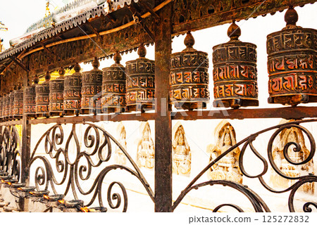 Prayer wheels in buddhist temple Prayer wheels in buddhist temple 125272832