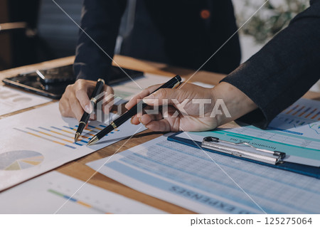 Accounting company provide finance and taxation planning for profitable cash flow, Auditor and accountant team working in office, analyze financial data and accounting record with calculator.Insight 125275064