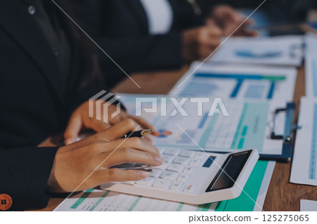 Business analyze,Close up Business people meeting to discuss the situation on the market. Business Financial Concept 125275065